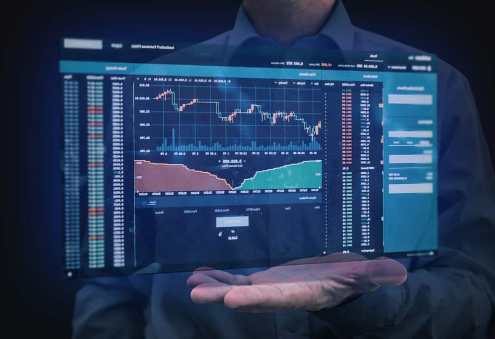 A futuristic holographic financial analysis display held by a man